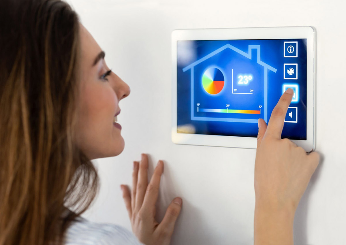Woman pointing to SmartHome display Hub